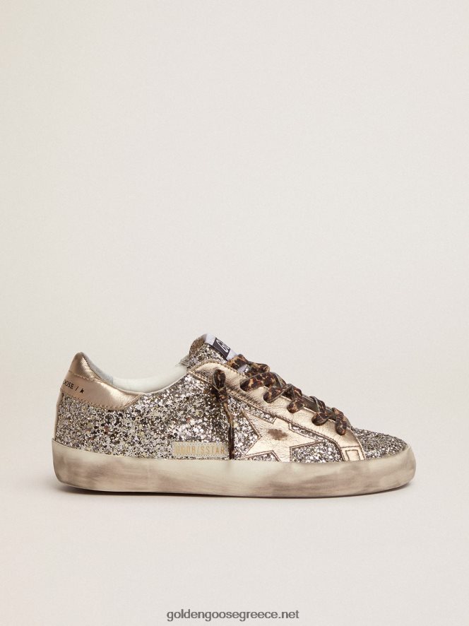 γυναίκες sneakers super-star σε γκλίτερ χρώματος πλατίνας με αστέρι και κούμπωμα φτέρνα από πλαστικοποιημένο δέρμα σε τόνουςGolden Goose 264N2R286